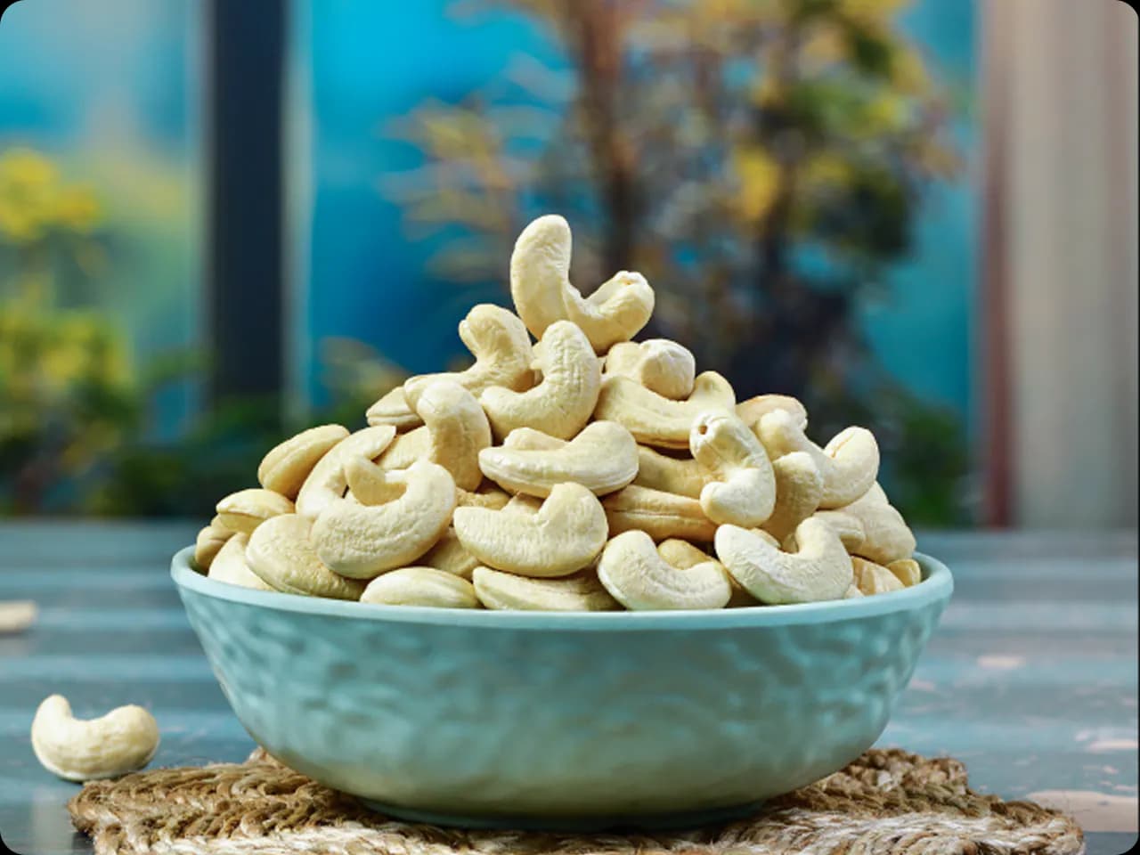 Bowl overflowing with cashews